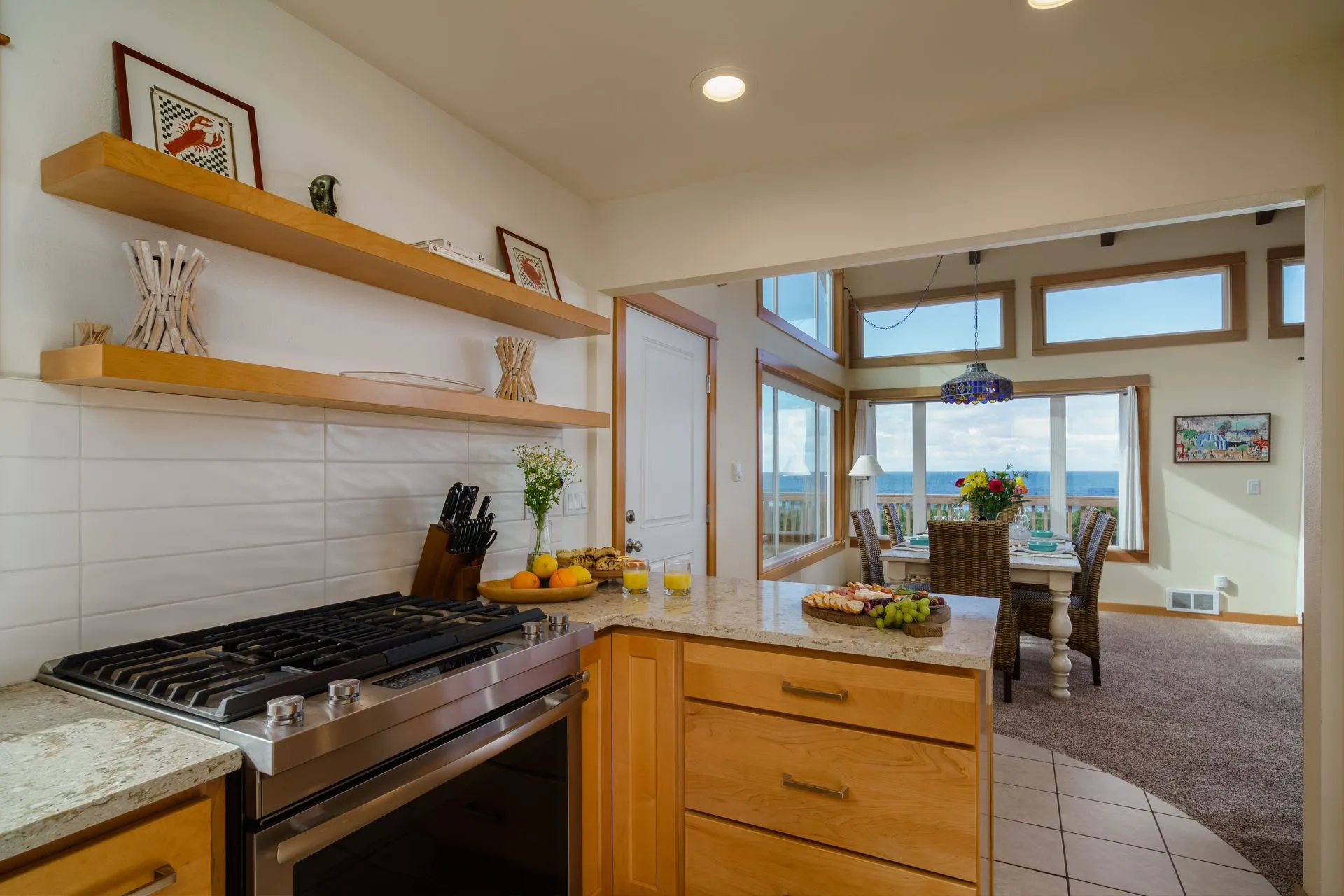 Vacation Rental in Cannon Beach, Pacific House kitchen with a stove and view of dining room