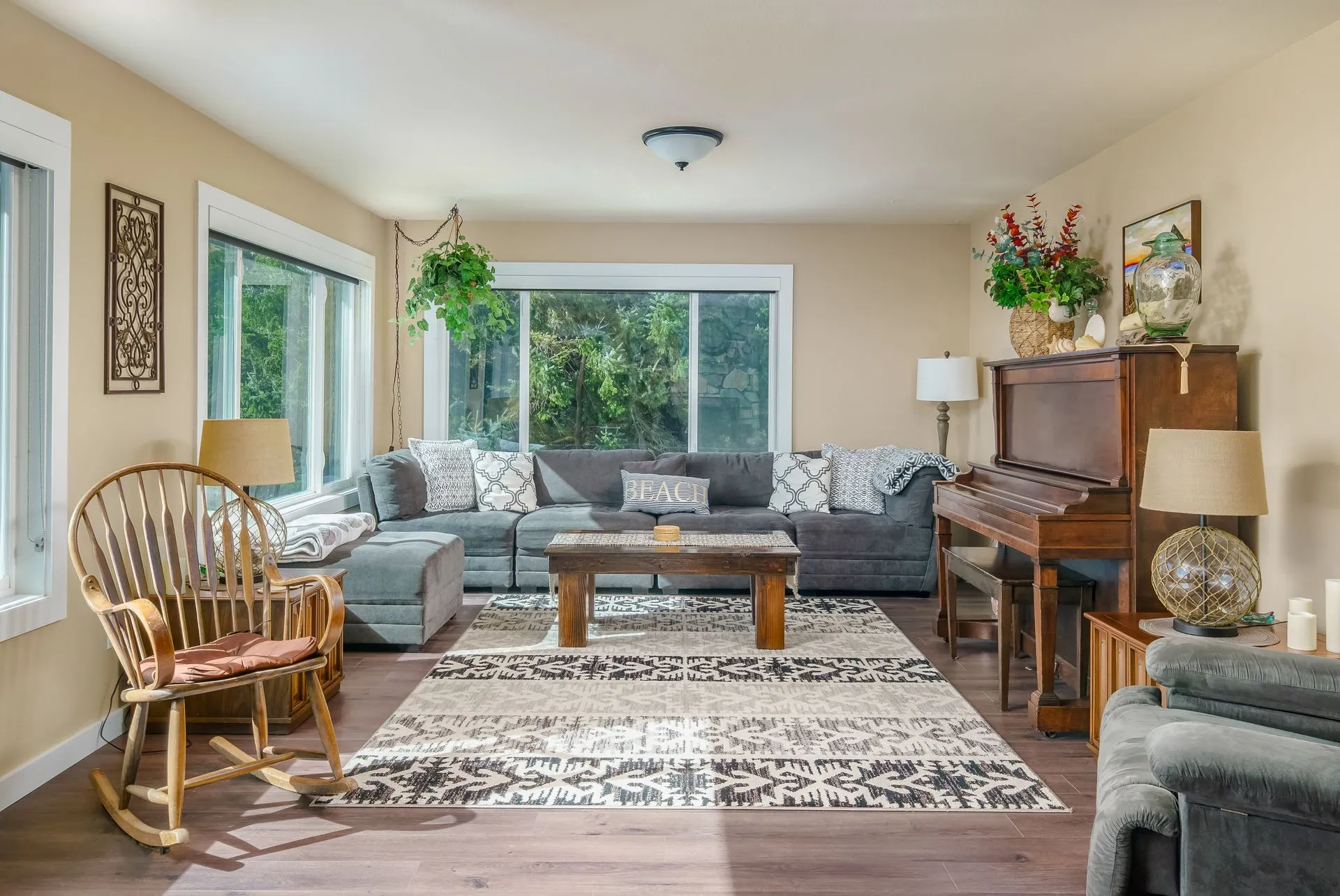 Vacation Rental in Cannon Beach, Anchor's Retreat living room with a piano, couch, rocking chair and armchair