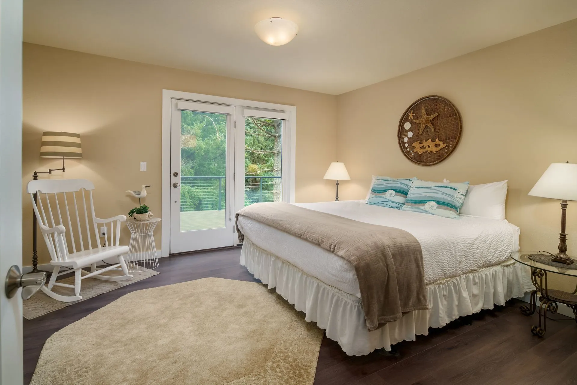 Vacation Rental in Cannon Beach, Anchor's Retreat bedroom with balcony and rocking chair