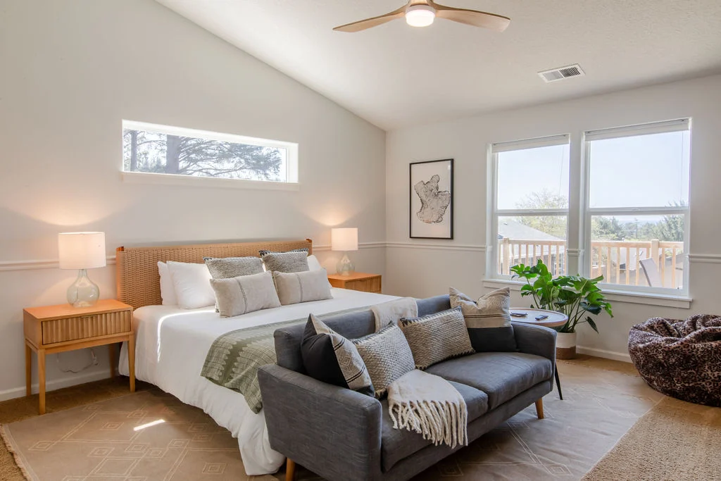 Haystack Hideaway - Master Bedroom with En Suite on upper floor Vacation Rental in Cannon Beach, Anchor's Retreat bedroom with two large window
